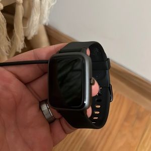 Smart watch w/charger. Works with iPhone or android.